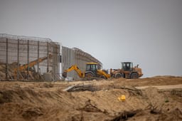 Tractors working on the border fence between Israel and the Gaza Strip, on December 28, 2023.
