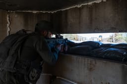 IDF soldiers guard at a temporary checkpointson a road in Northern Israel, near the border with Lebanon, January 6, 2024.