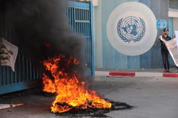 Palestinians protest demanding compensation for damaged homes in the 2014 war, outside the headquarters of "UNRWA", in Gaza City, on September 5, 2022.