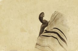 Jewish man blowing the Shofar (horn) 