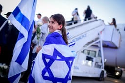 New immigrants from France arrive on a special " Aliyah Flight" at the Ben Gurion airport in central Israel on August 1, 2024.