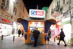 An Israeli man plays the lotto at a lotto booth in the center of Jerusalem