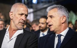 Ronen Bar (left), head of the Shin Bet security services, speaks with Mossad chief David Barnea during the annual Holocaust Remembrance Day ceremony at the Yad Vashem Holocaust Museum, Jerusalem, May 5, 2024. 