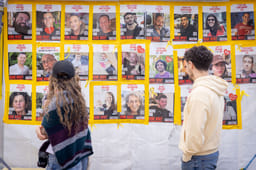 Passing pictures of hostages.