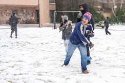 People enjoy the snow in Kibbutz El Rom, in the Golan Heights, Northern Israel, February 06, 2025