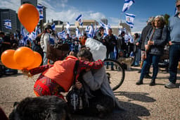 People gather at Hostage square in Tel Aviv, on the day of the release of the bodies of four Israeli hostages from Hamas captivity, February 20, 2025