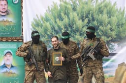 The hand over Israeli hostages to the Red Cross, as part of the ceasefire agreement between Israel and Hamas, in Nuseirat Camp, in the central Gaza Strip, February 22, 2025