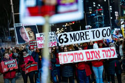 Demonstrators protest for the release of Israelis held hostage in the Gaza Strip, outside Hakirya Base in Tel Aviv, February 22, 2025