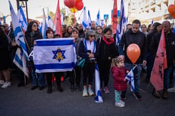 People pay their respects during the funeral service of late Israeli hostages Shiri Bibas and her children Ariel and Kfir in Rishon LeZion, February 26, 2025. 