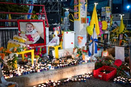 Lighting candles for murdered hostages.