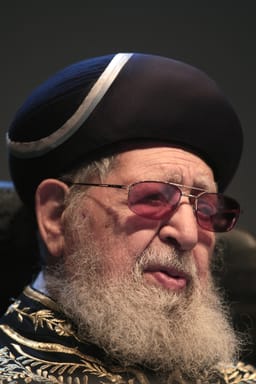 Shas spirtual leader Rabbi Ovadia Yosef looks on as Ultra Orthodox Jewish men gather for a conference at the Jerusalem's International Convention Center