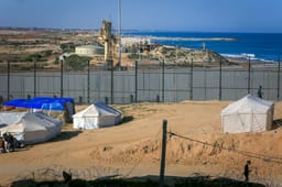 Displaced Palestinians pitch their tents next to the Egyptian border with the city of Rafah in the southern Gaza Strip