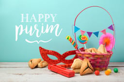 Purim holiday greeting card with hamantaschen cookies and carnival mask 