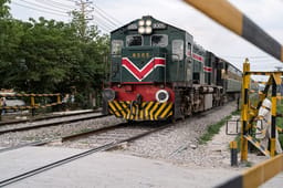 Pakistan train approaches railway crossing 