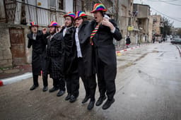Merriment on Purim. Illustration (those photographed unrelated to article).