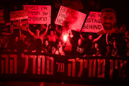 Demonstrators protest for the release of Israelis held hostage in the Gaza Strip, outside Hakirya Base in Tel Aviv, March 15, 2025. 