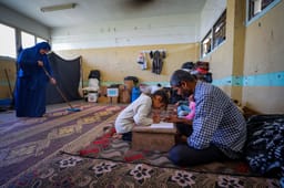 alestinians live inside an unrwa school in the central Gaza Strip on March 14, 2025. 