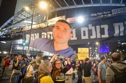 Demonstrators protest for the release of Israelis held hostage in the Gaza Strip, outside Hakirya Base in Tel Aviv, March 15, 2025. 