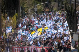 Israelis attend a protest march against the decision of Israeli prime minister Benjamin Netanyahu to fire head of Shin Bat Ronen Bar, in Jerusalem. March 19, 2025. 