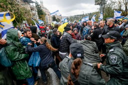Israelis clash with police during a protest against the decision of Israeli prime minister Benjamin Netanyahu to fire head of Shin Bat Ronen Bar, in Jerusalem, March 20, 2025