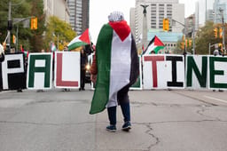 Pprotesters hold letters that spell Palestine at a protest for Palestinians against the War in Gaza in Toronto, Canada 
