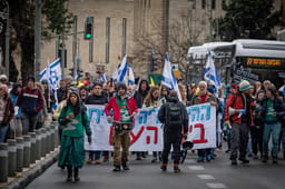 Demonstrators protest march against the Israeli government vote to fire Shin Bet Chief Ronen Bar and against Israeli Prime Minister Benjamin Netanyahu in Jerusalem, March 21, 2025. 