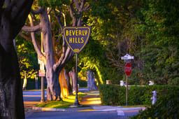 Beverly Hills sign at the corner of Sierra Drive and Sunset Boulevard