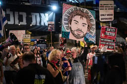 Demonstrators protest for the release of Israelis held hostage in the Gaza Strip, outside Hakirya Base in Tel Aviv, April 2, 2025