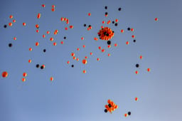 Orange and black balloons released to the sky during a memorial ceremony for late Israeli hostages Shiri Bibas and her children Ariel and Kfir in Jerusalem, February 26, 2025. 