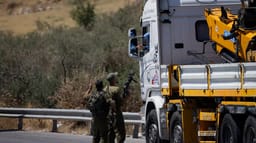 IDF trucks entering an army base