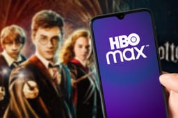HBO Max app running on smarthphone with Harry Potter on background