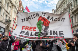 UK: Pro-Palestinian protesters hold a banner and chant at a demonstration calling for an end to Israeli attacks on Gaza
