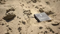 A bible in the sand.