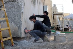 Volunteers renovating homes destroyed during the October 7 massacre, in Kibbutz Kfar Aza, December 2, 2024. 