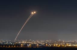 Anti-missile system fires interception missiles as missiles fired from Iran as it seen over central Israel, June 19, 2025.