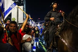Israelis block the Ayalon Highway in Tel Aviv as they protest against Israeli Prime Minister Benjamin Netanyahu's decision to fire Defense Minister Yoav Gallant, November 5, 2024. 