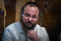 Chaim Rotter, arrested on suspicion of numerous sex offenses arrives to a court hearing at the Magistrate's Court in Tel Aviv on July 2, 2025. 