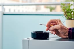 Smoking cigarettes at an appartment