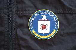 KYIV, UKRAINE - JUNE 26, 2024 United States of America Central Intelligence Agency coat of arms as pin on black uniform jacket close up
