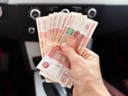 Man holding Russian currency