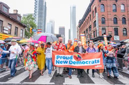 New Democratic Party members marching in a Toronto Pride Parade.