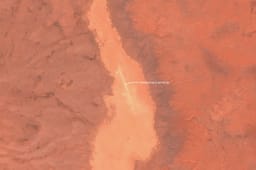 a temporary ~1.6km airstrip was set up in a dry lake bed about 180km southwest of Najaf/Karbala
