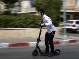 A charedi boy on an electric scooter. Illustration.