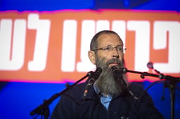 Rabbi Yigal Levinstein speaks during a rally in support of the current Israeli government, outside the Supreme Court in Jerusalem, on June 5, 2025.