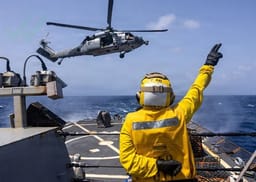 Helicopter taking off from the aircraft carrier