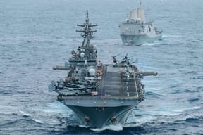 USS Boxer (LHD 4) and USS Portland (LPD 27) sail in formation while transiting the Indian Ocean,