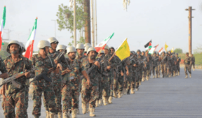 Houthi soldiers holding Iranian and Hezbollah flags