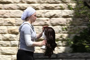 Jewish woman carrying a wig