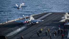 Fighter jets take off from the USS Lincoln