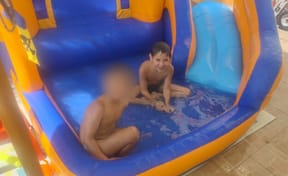 The two boys playing in the pool before the attack where Hillel was killed